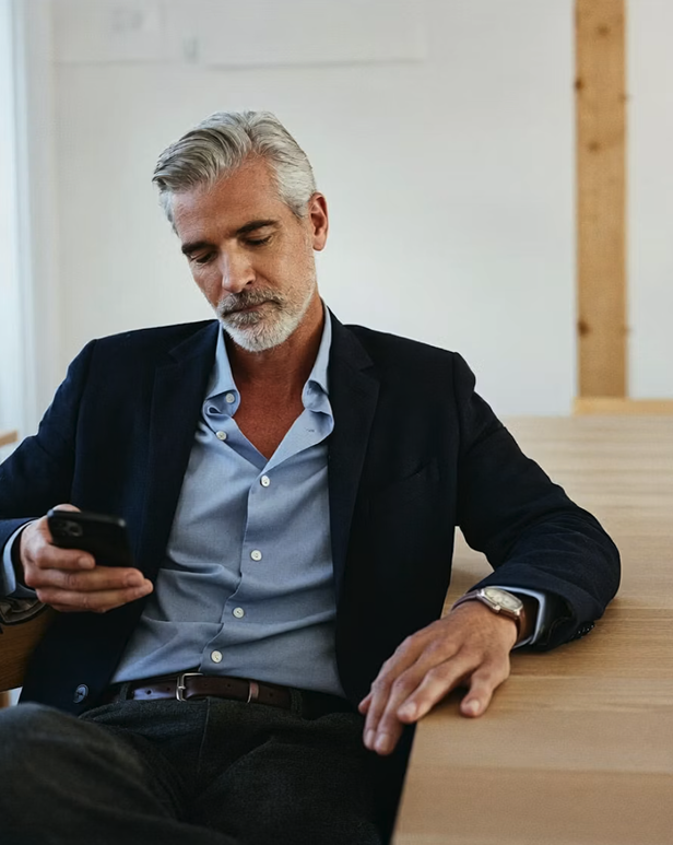 Compliance professional with a smartphone